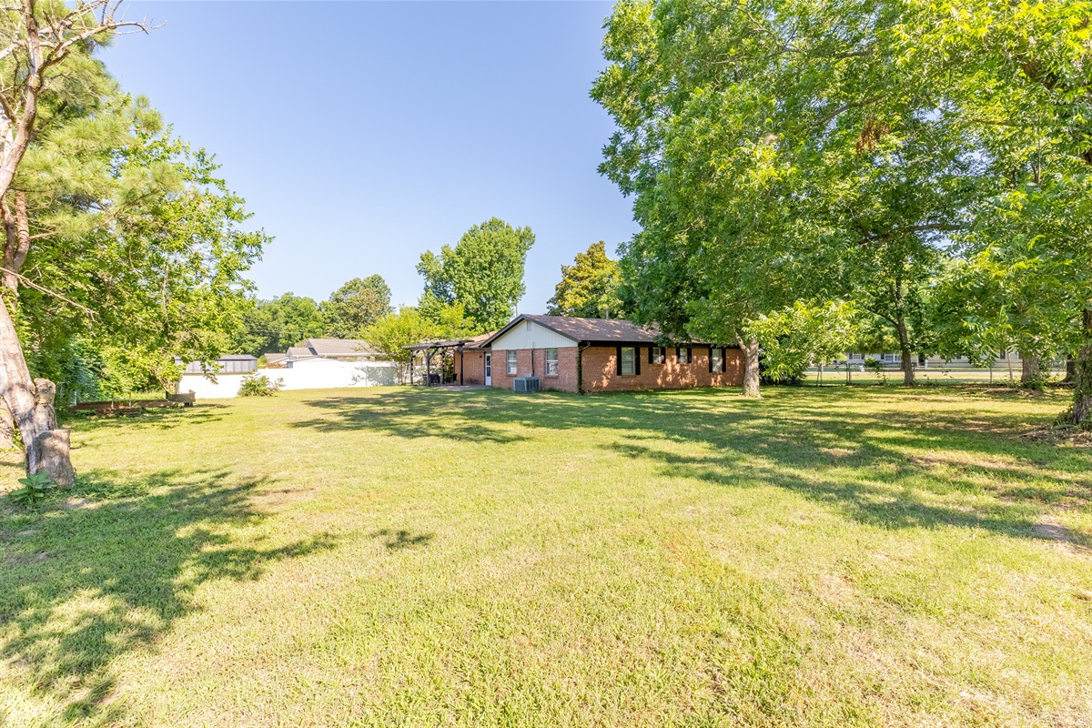 Spacious fenced yard for relaxation and play.