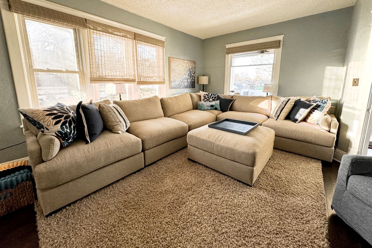 Huge, oversized sectional provides comfortable seating in the Main Level Living Room.