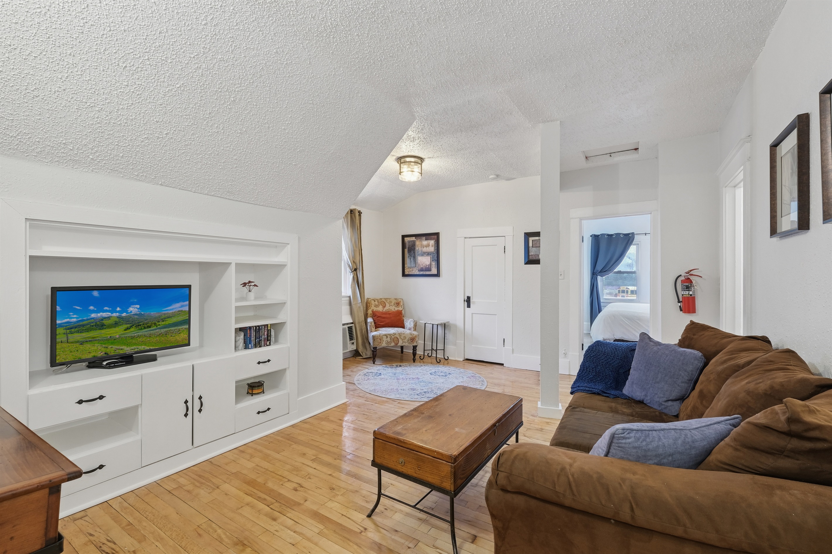 The living room has a Roku-enabled TV and other comfortable amenities for you to relax and enjoy your stay. 