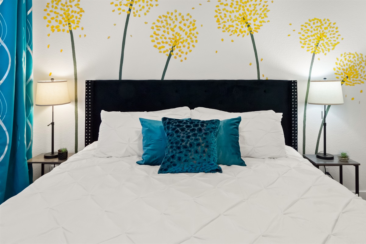 Comfortable king bed with soft linens and plush pillows