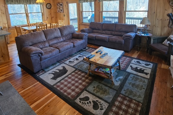 Comfortable living room after a full day. Coffee table has been updated to an ottoman with trays.