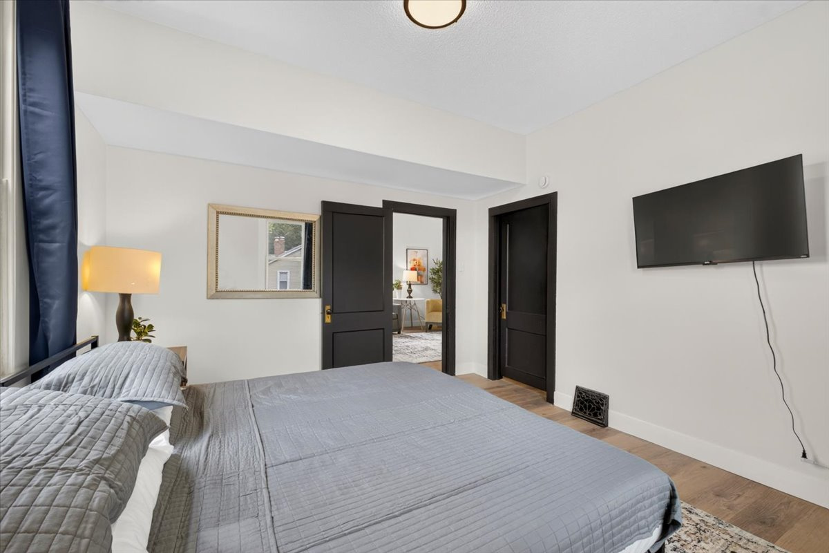 The master suite features a king-size bed and a TV for you to enjoy.