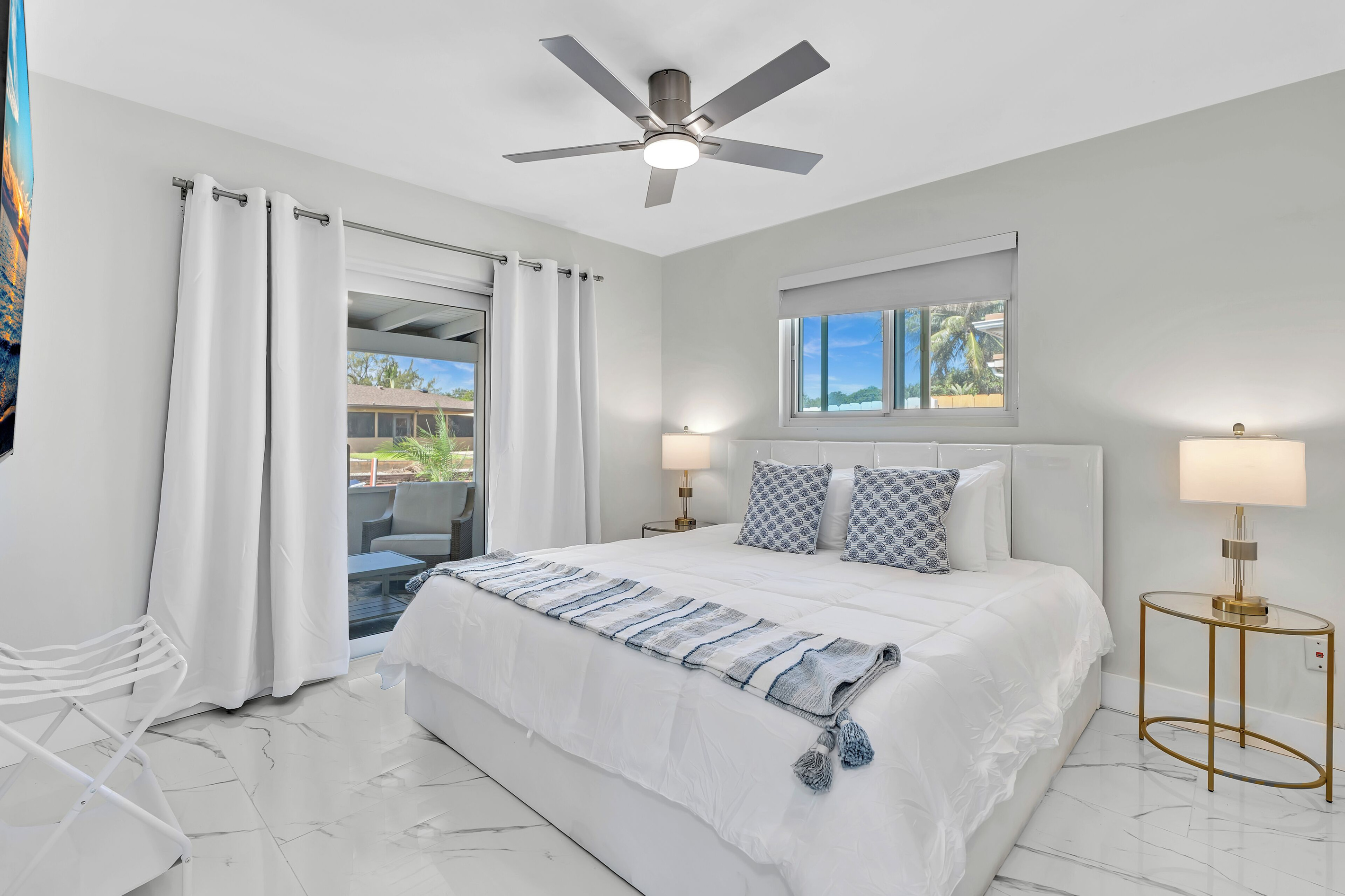 Relax in the king suite featuring water views, patio access and plenty of natural light.