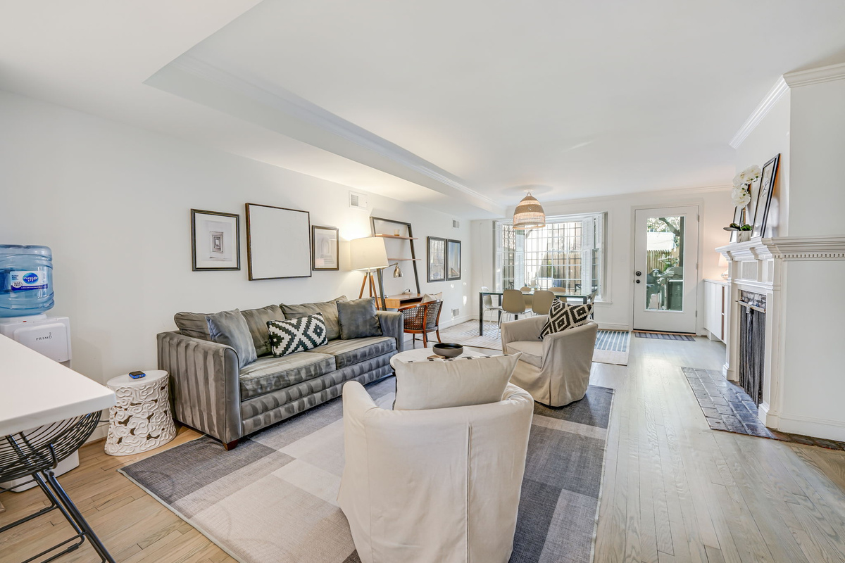 Living/Dining Room: Sleeper Sofa, Desk, Door to Patio, Free Parking, EV Charging.
