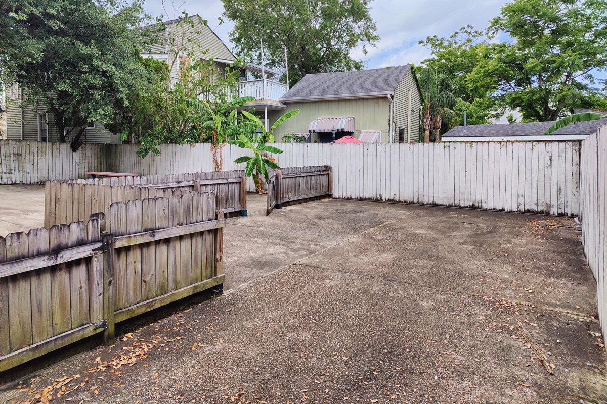 Rear courtyard shared with upstairs unit.