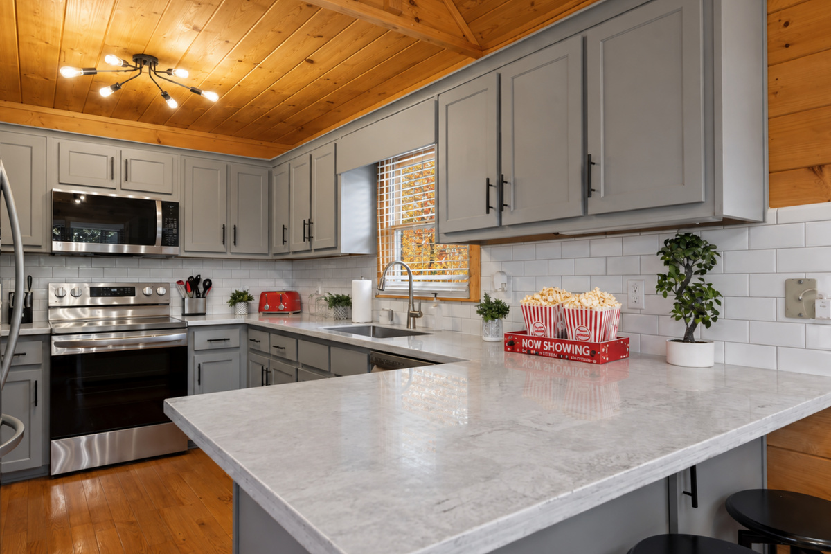 Step into the cream-toned kitchen... fully stocked, beautifully designed, and ready for feasts.