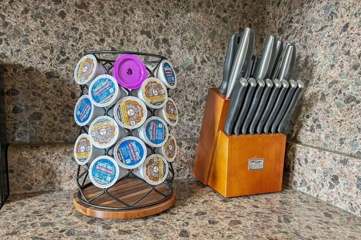 Well-equipped kitchen with a knife set for precision cutting and coffee capsules for your perfect brew.