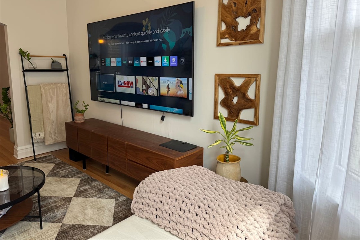 Living room entertainment area with comfortable seating.