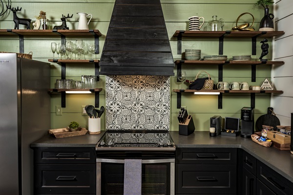 Stylish open-shelf kitchen with designer tile and everything you need for a perfect stay