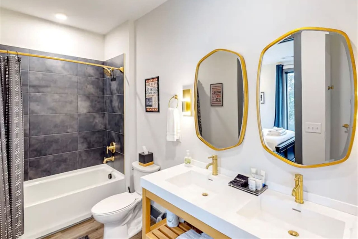 Bathroom Retreat: Elegant dual vanities and modern fixtures invite relaxation in style!
