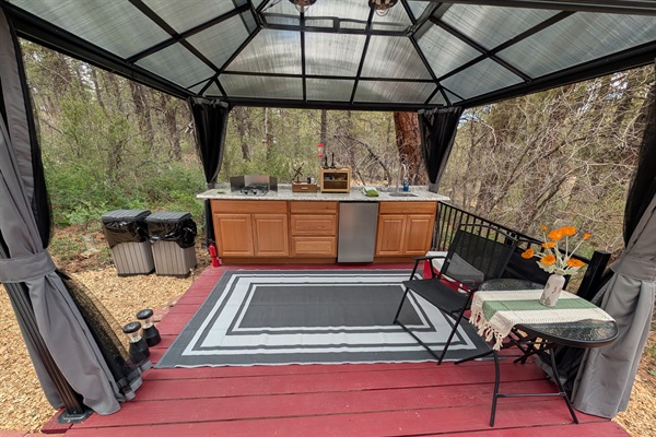 Newly remodeled Kitchen space.  Includes a 2 burner stove, a dorm style refrigerator and a sink with hot water.