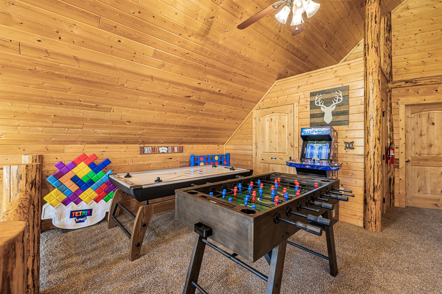 Upstairs game area w/ air hockey, foosball table, and arcade