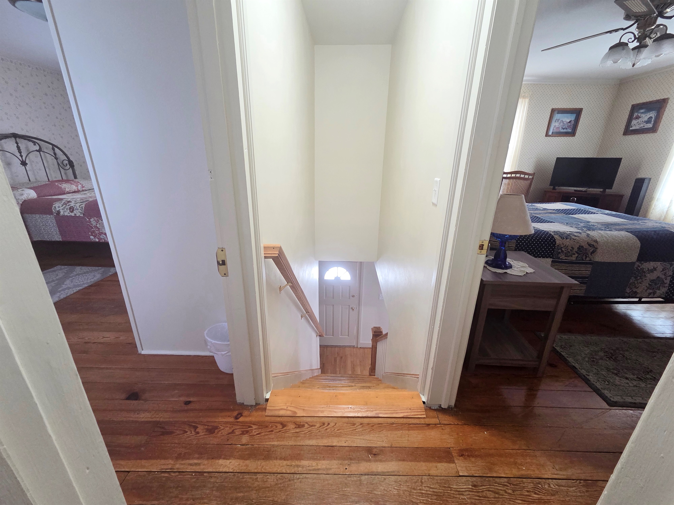 A set of steps inside the house leads to the upstairs bedrooms and bathrooms, adding to the home’s cozy layout.