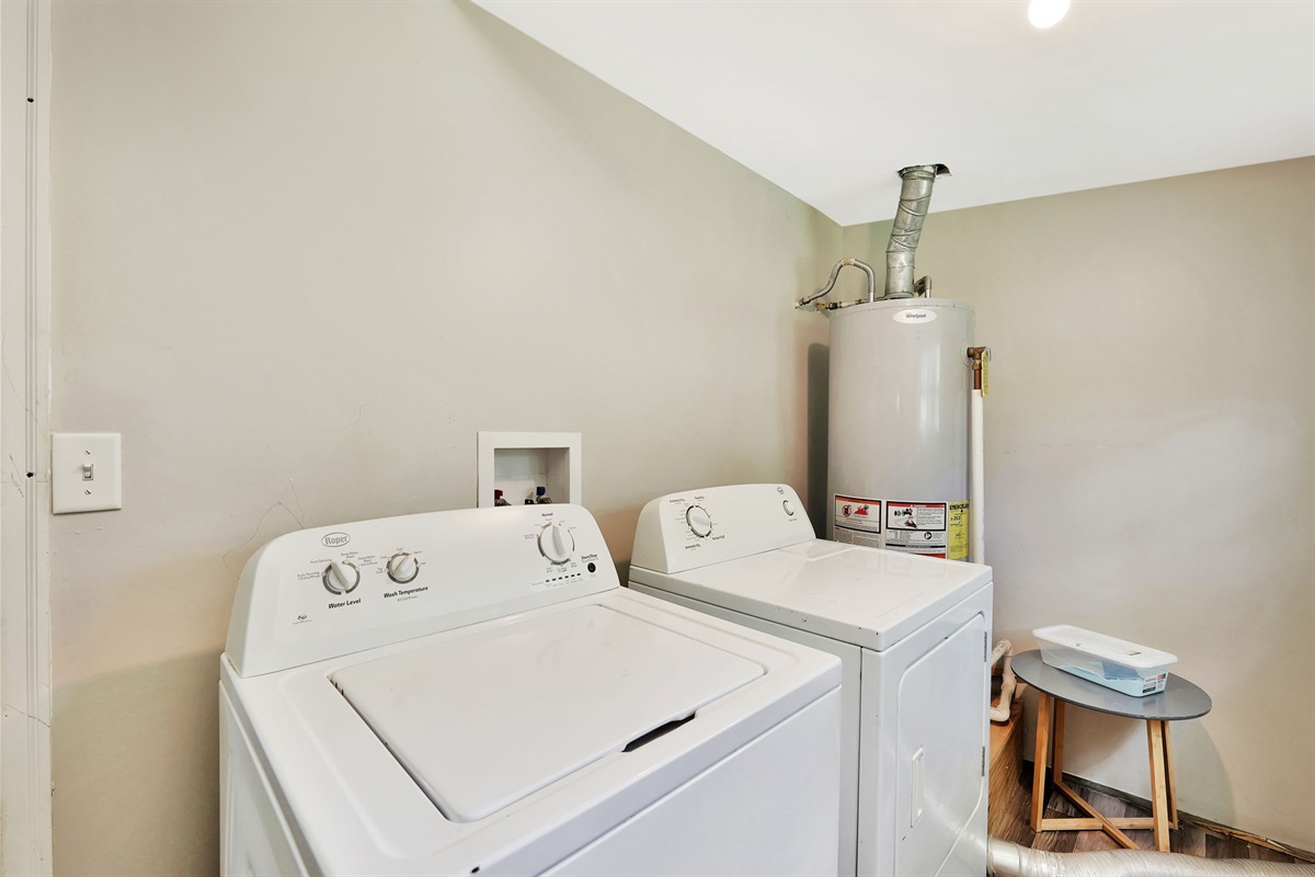 Laundry room off the kitchen for convenient washing and drying.