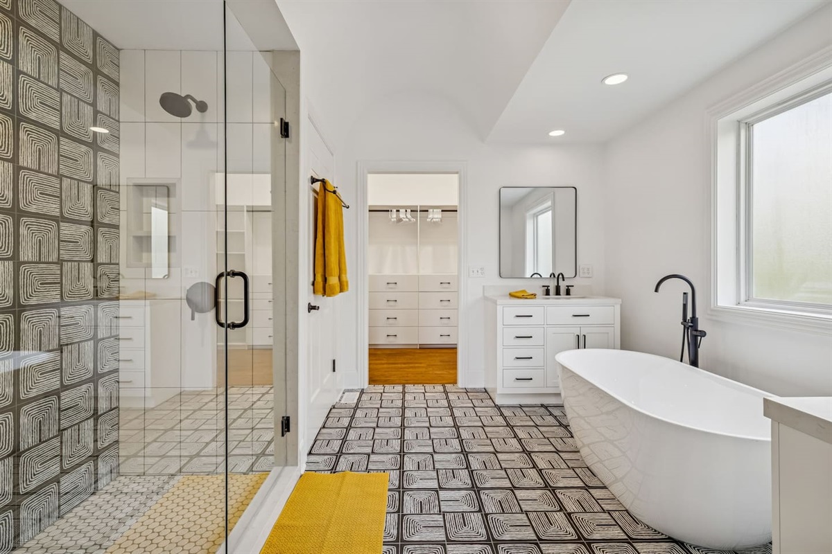 Bath Room has two single sink vanities, private toilet room, beautiful stand alone Tub, and access to Master Closet.