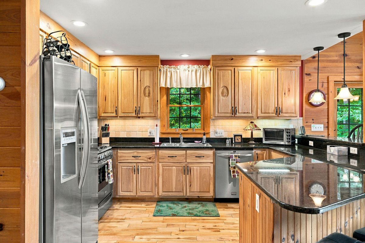The fully equipped kitchen offers generous cabinetry and plenty of meal-preparation space.