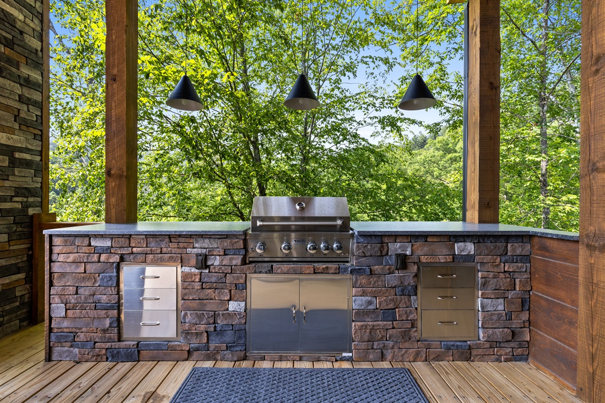 Grill under the open sky, with the trees as your audience.