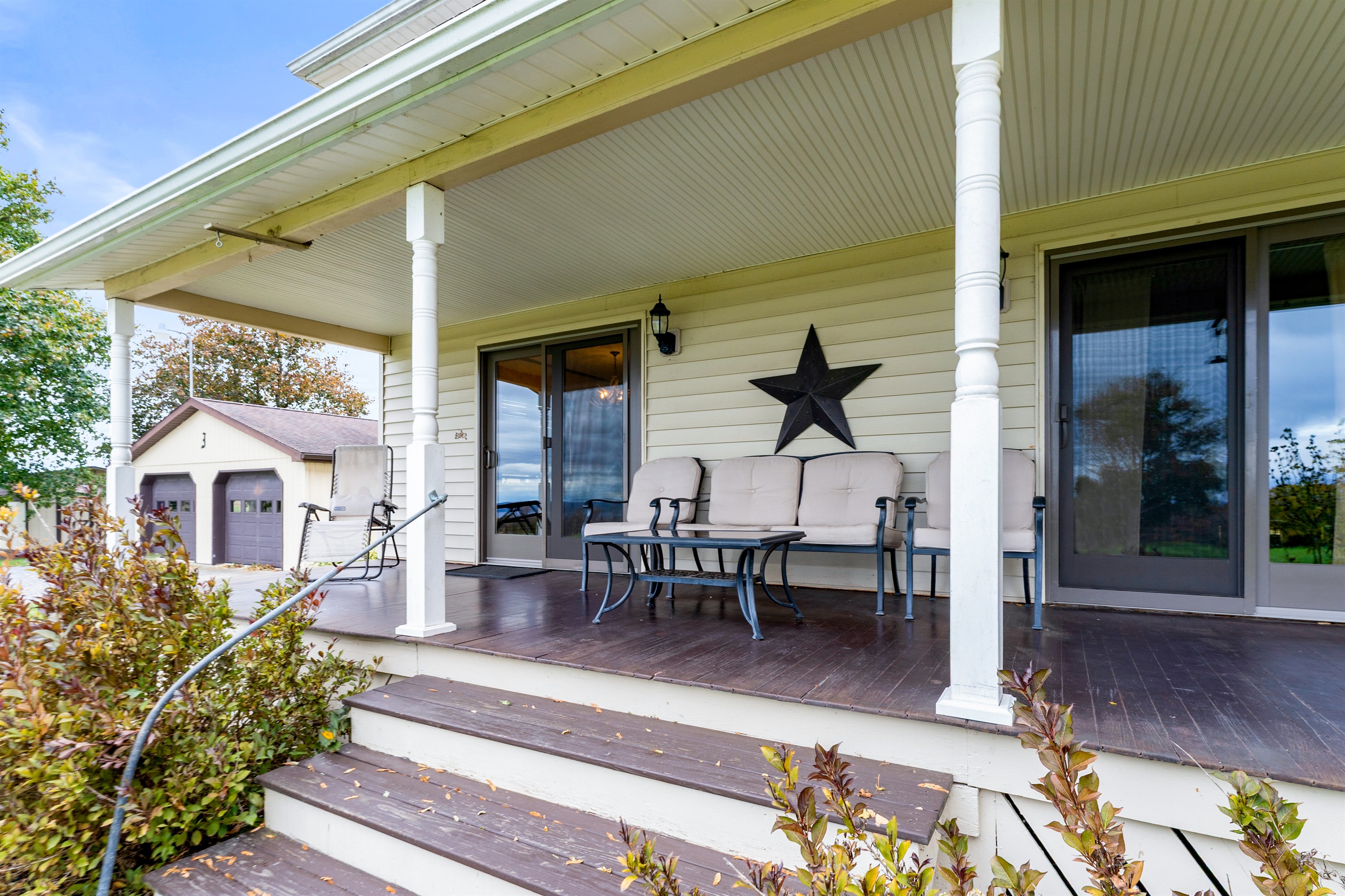 Rocking chairs and peaceful mornings await on this wrap-around porch