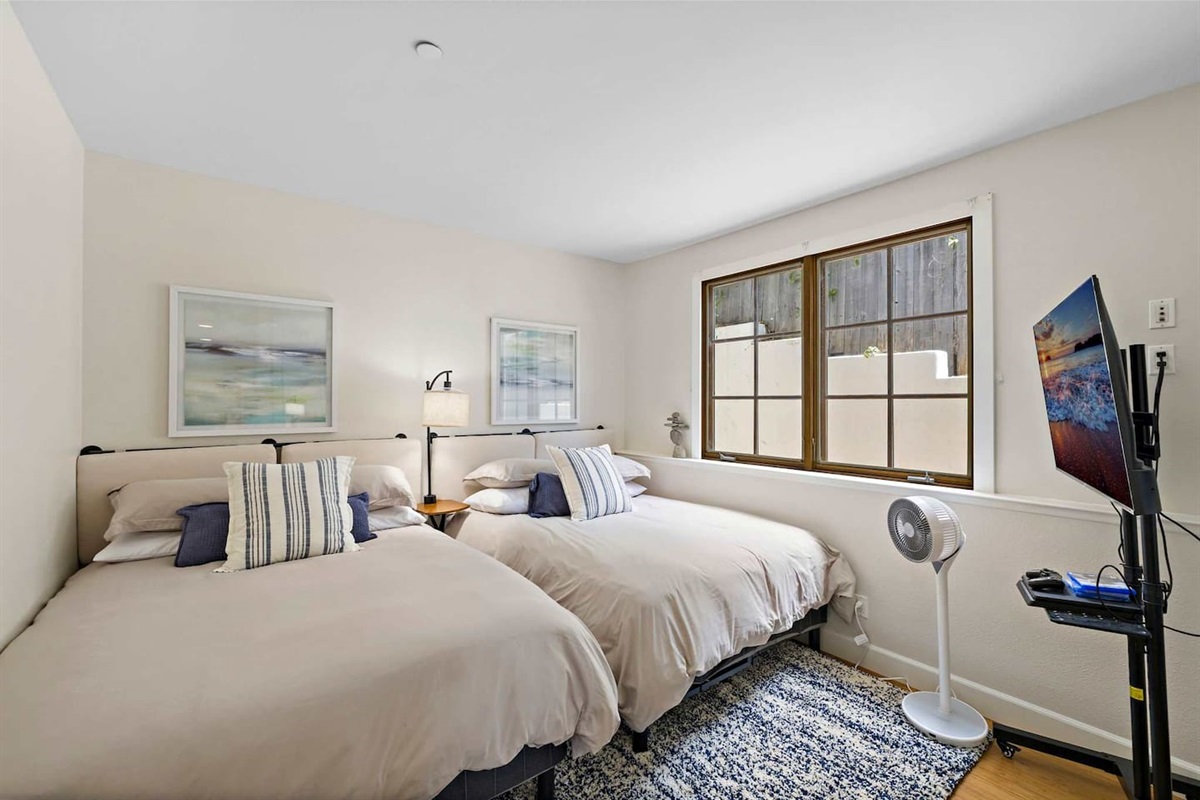 Our 2nd bedroom contains two queen beds with premium mattresses, a 55"smart TV with Disney Plus, Hulu, Peacock, Max and Amazon Prime as well as a PlayStation 4 for "down time."