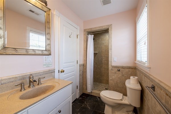 Unwind and relax in The Hemingway's exquisite bathroom! Lose yourself in an luxurious space designed to help you achieve a sense of peace and tranquility. Soak in the rain shower and admire th