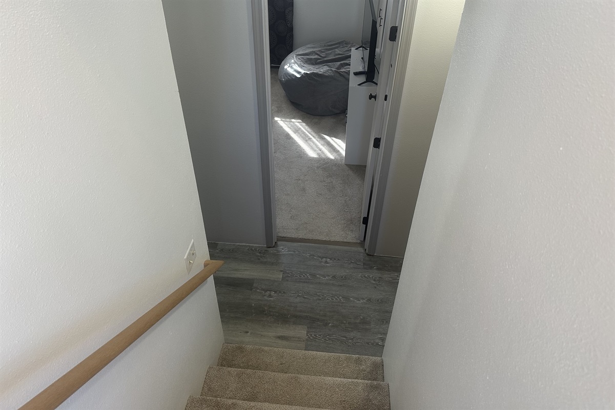 This is a split level home with stairs to the basement or the main floor from the entrance