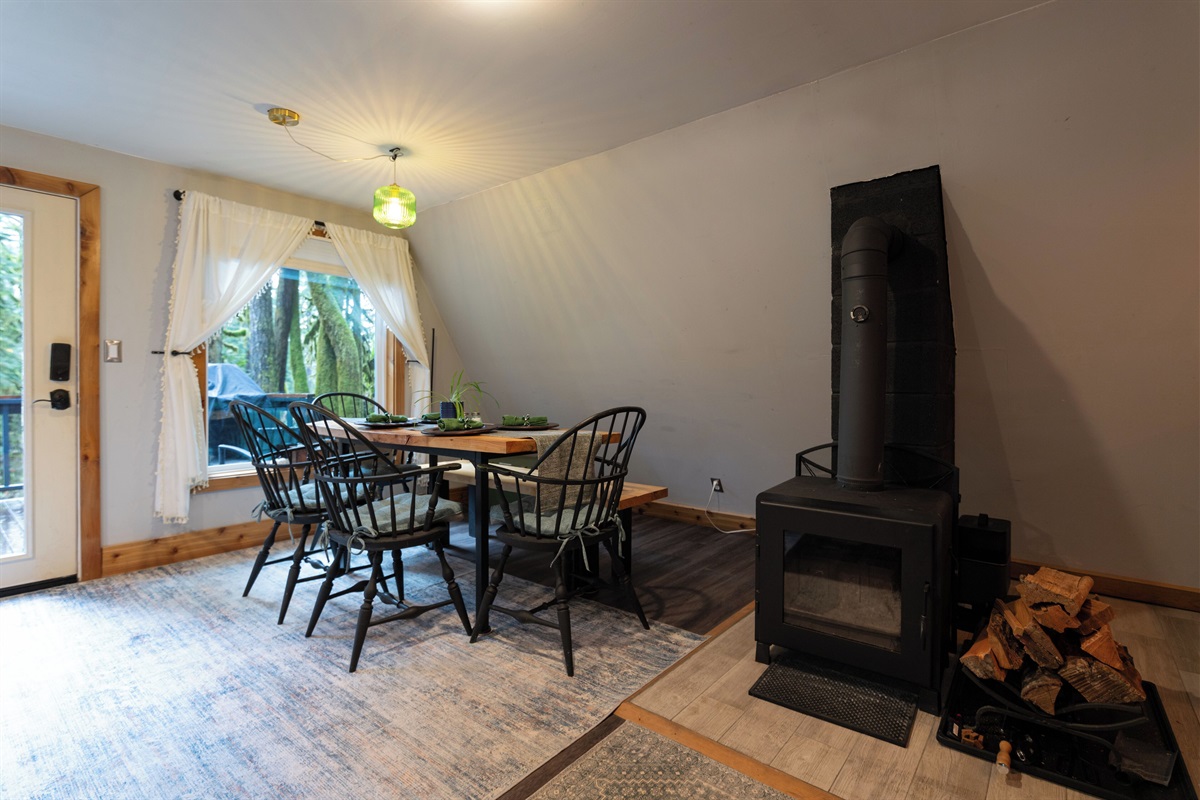 Wood-burning fireplace stocked with kindling, fire starters, and firewood