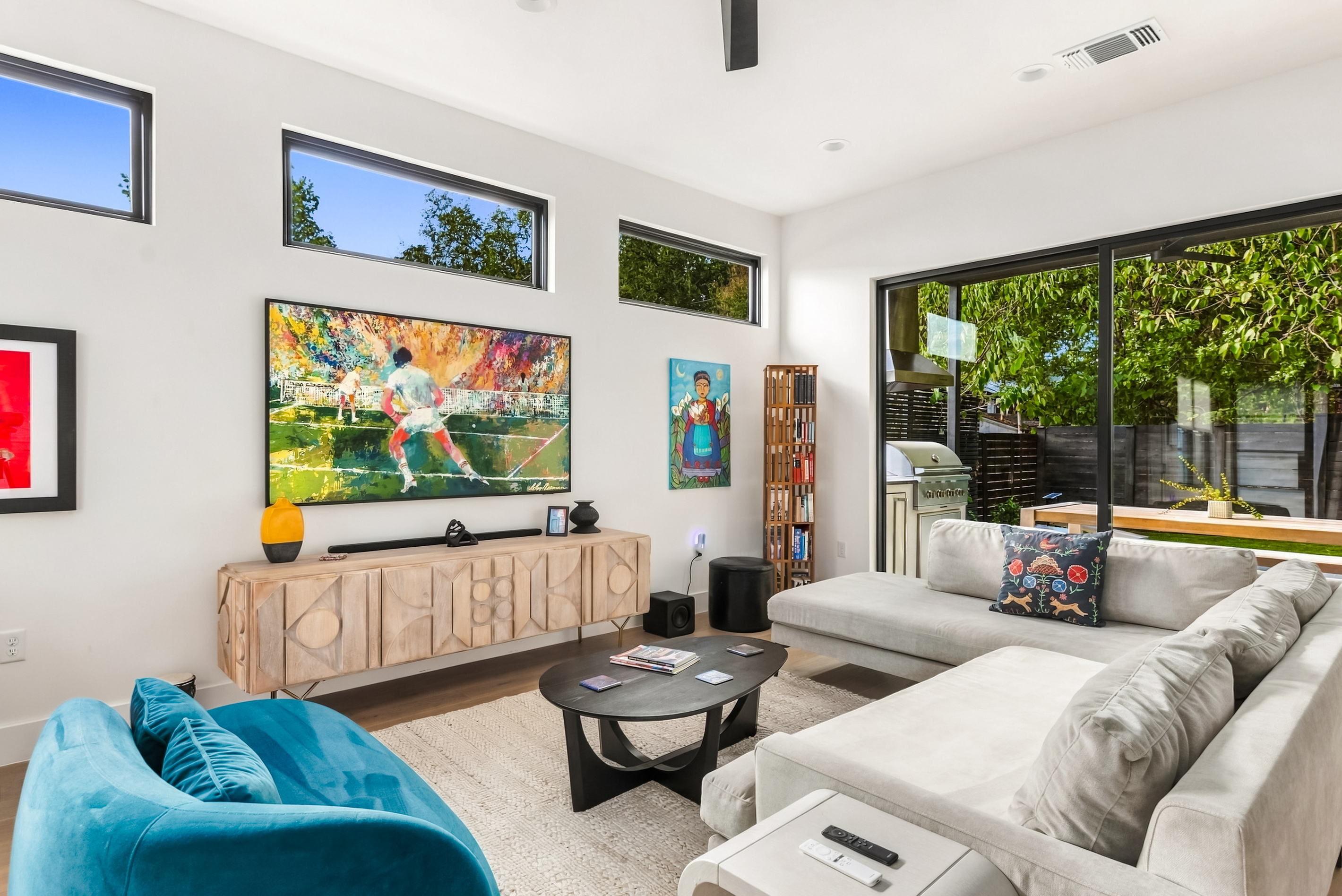 75" TV and cozy seating make this living room ideal for movie nights.