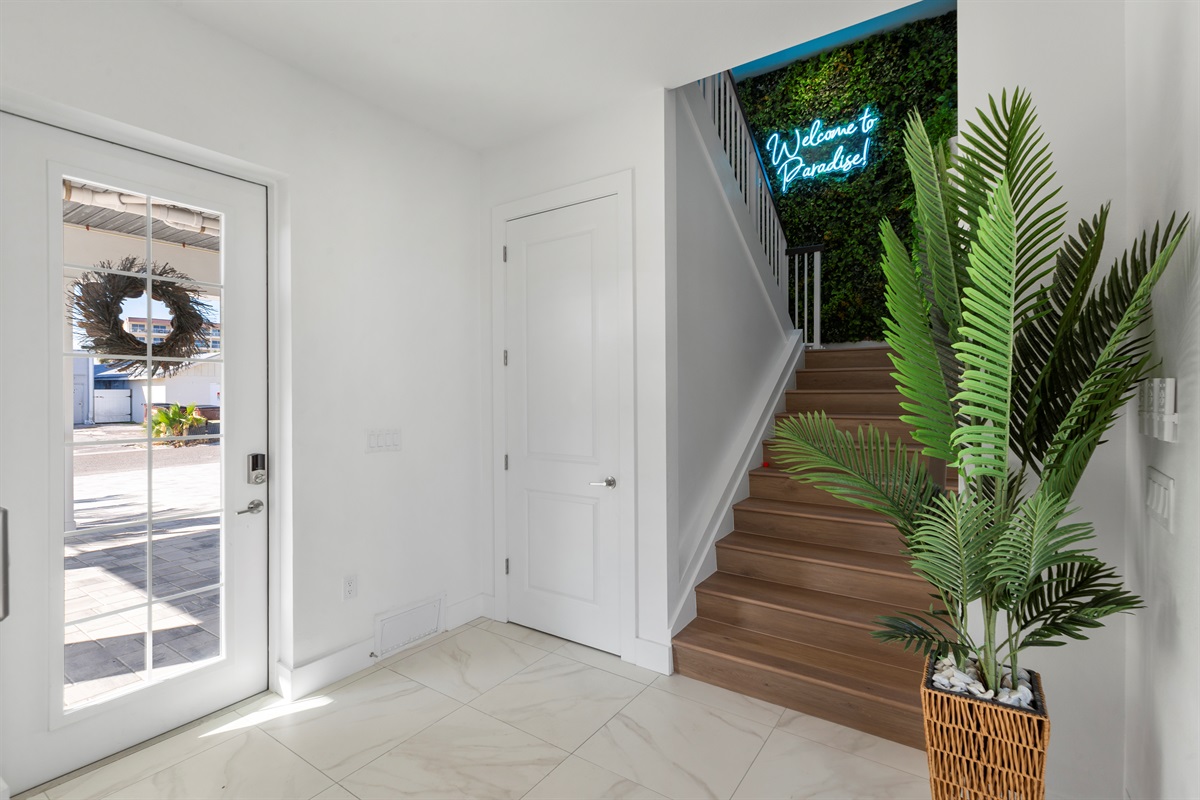 Take jaw dropping instagram photos on our "Welcome to Paradise!" LED Greenery wall