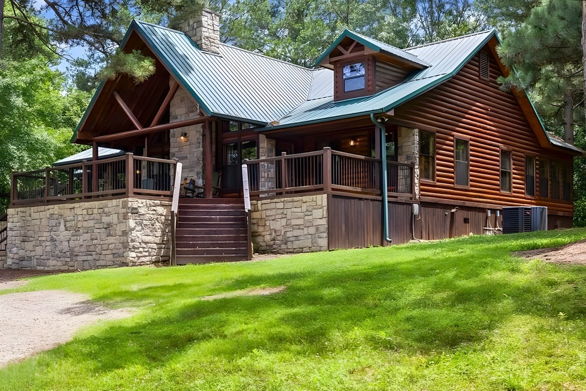 A different angle highlights the cabin’s classic log design.
