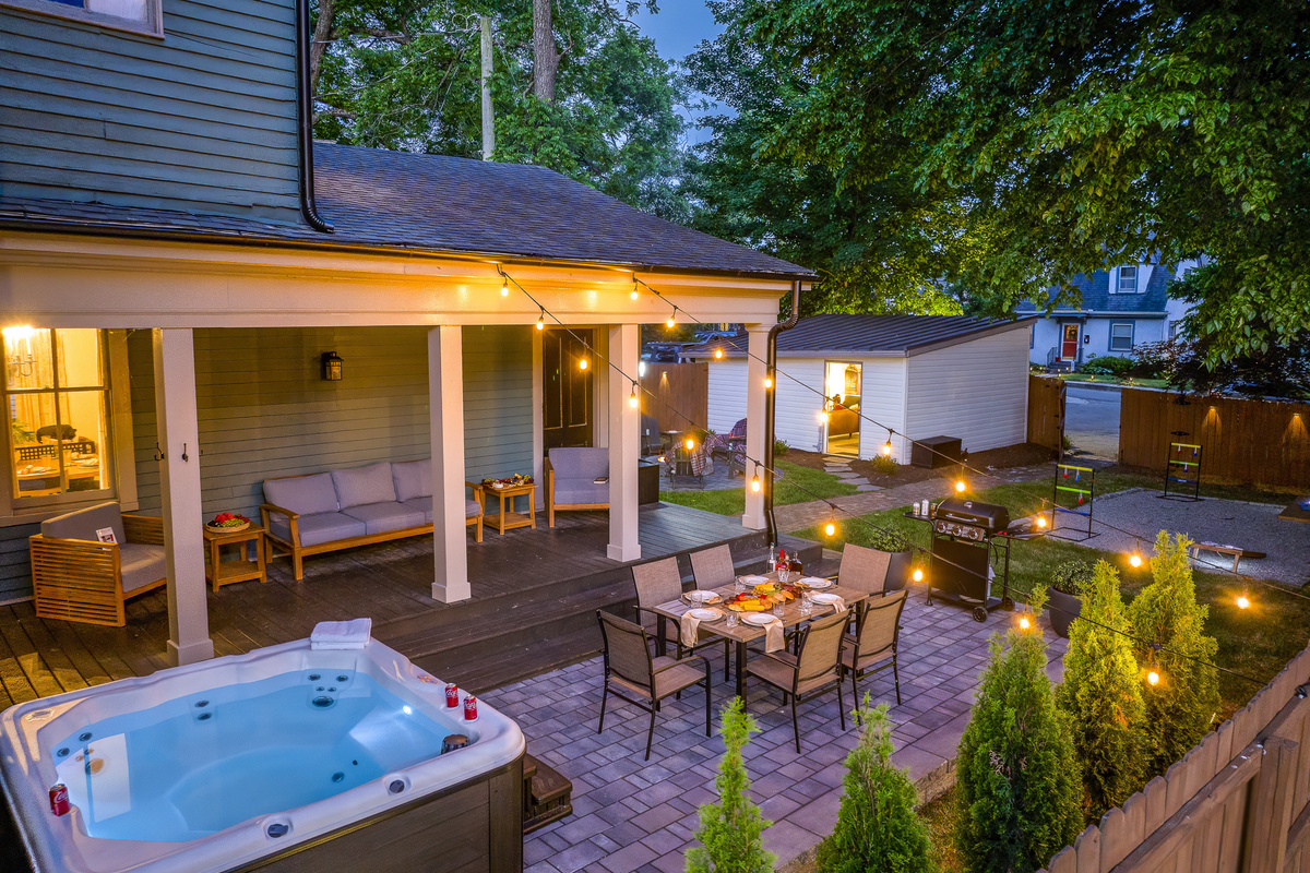 Every inch of the backyard was lit up for the perfect night, with the hot tub glowing, string lights twinkling, and the fire pit ready to enjoy.