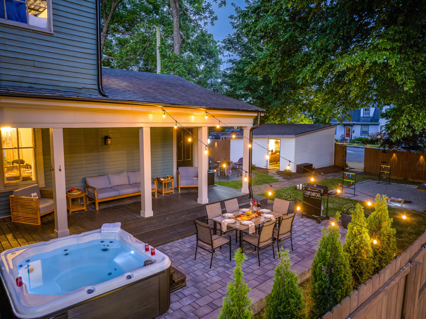 Every inch of the backyard was lit up for the perfect night, with the hot tub glowing, string lights twinkling, and the fire pit ready to enjoy.