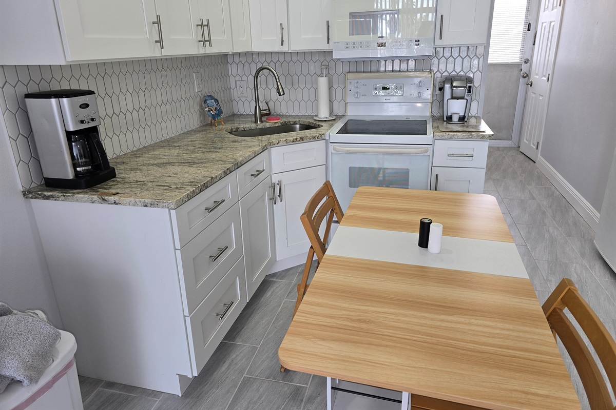 Compact fold-out dining table