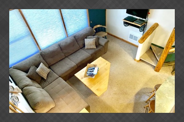 Over-head view of living room from loft area