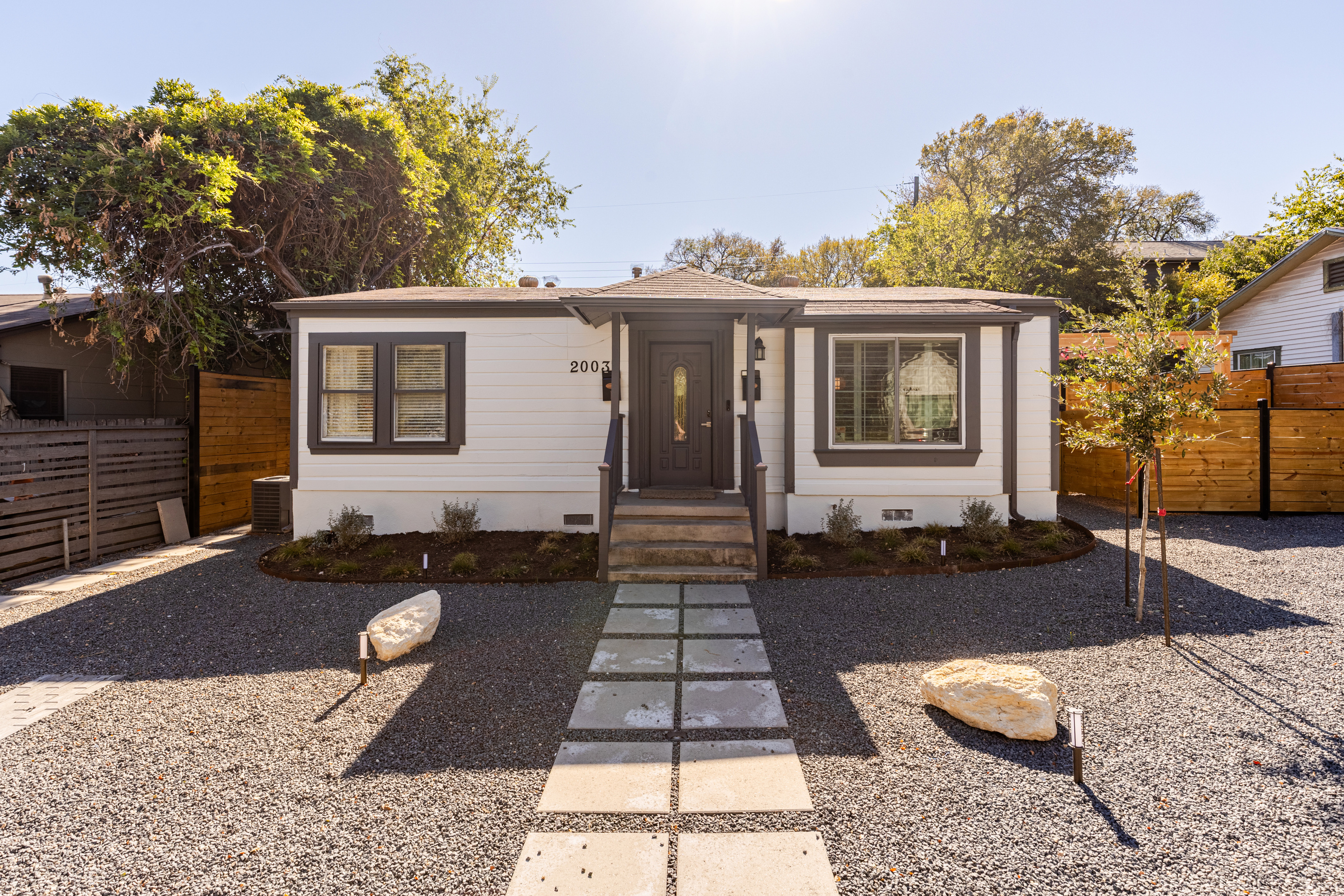 Bright exterior with inviting pathways, perfect for a picturesque Austin getaway!