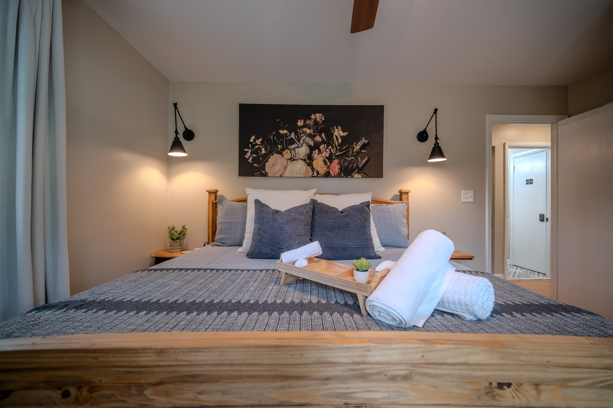 Designed with comfort in mind, the primary suite offers a king bed, soft bedding and fluffy pillows.