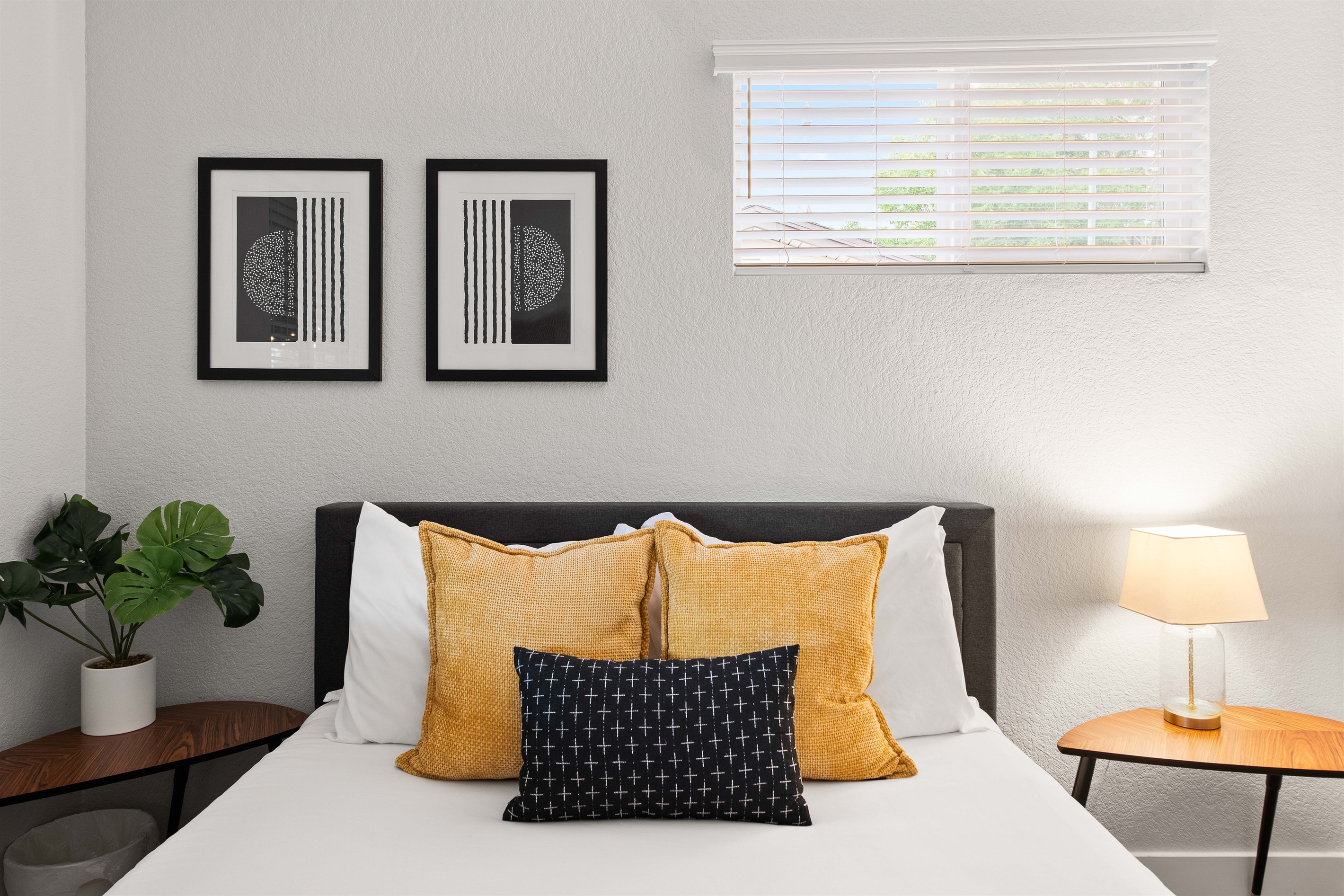 Queen bedroom with pops of color and crisp linens