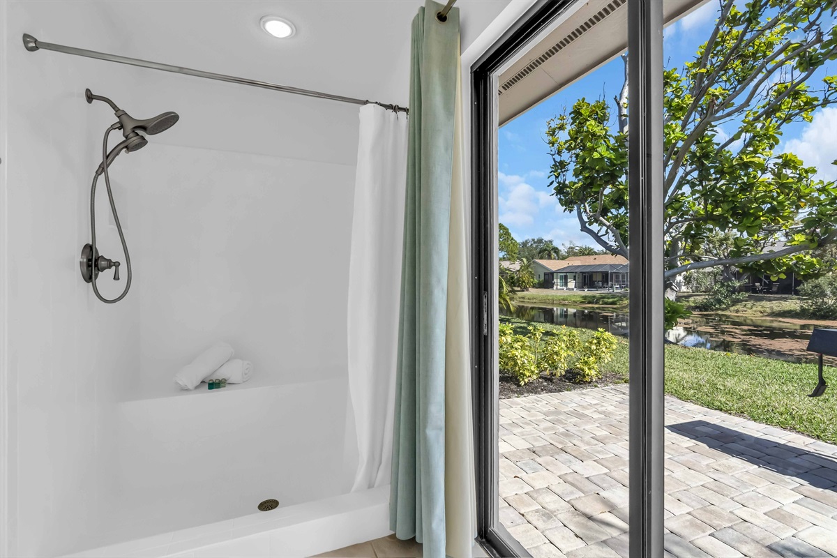 Primary shower displaying minimal step into shower area.