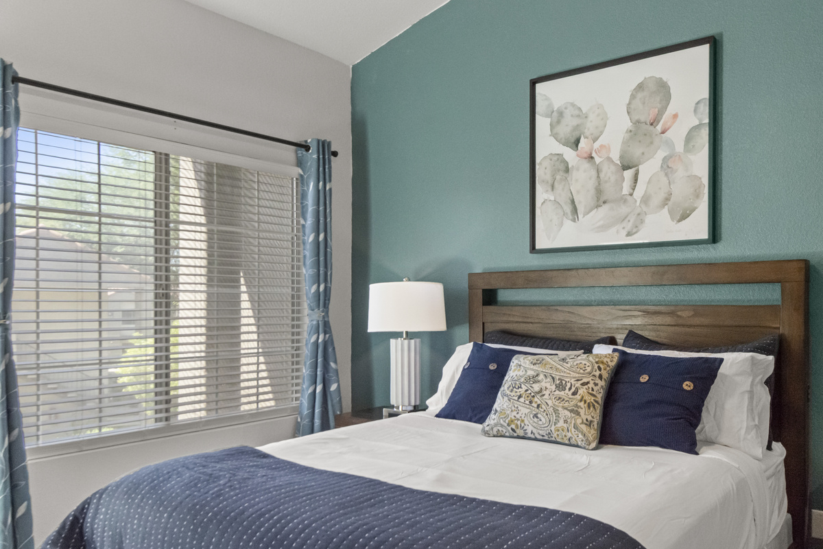Comfortable bedroom with a cozy bed, stylish décor, and plenty of natural light for a relaxing stay.
