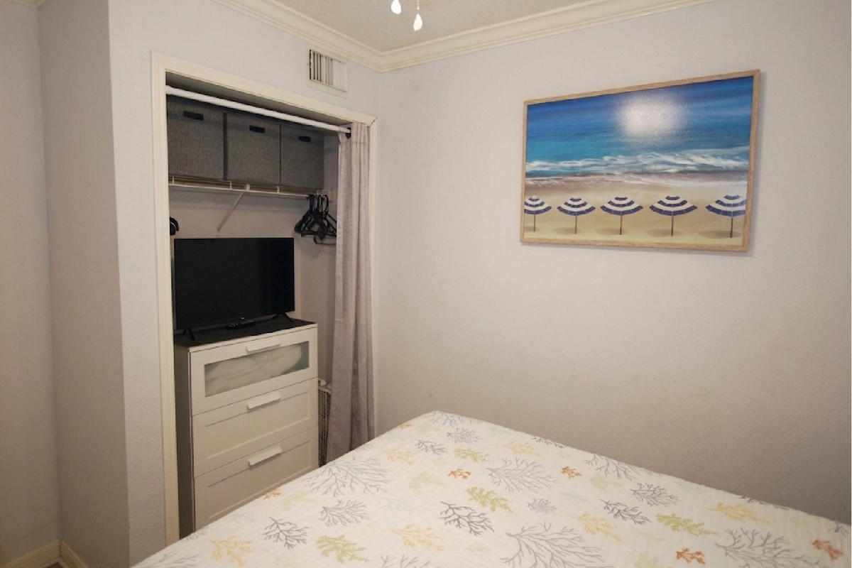 With clothing storage and a separate television