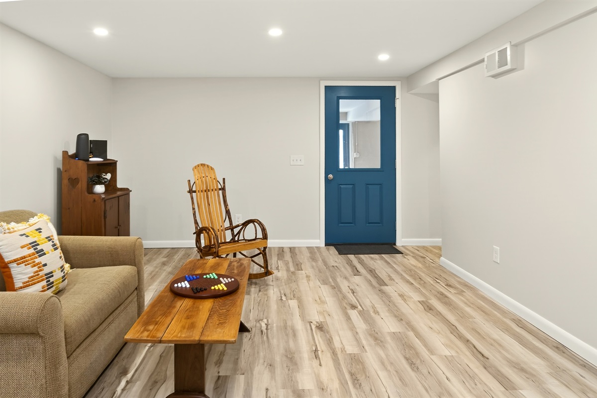 Lower level common area with access to the garage and exterior