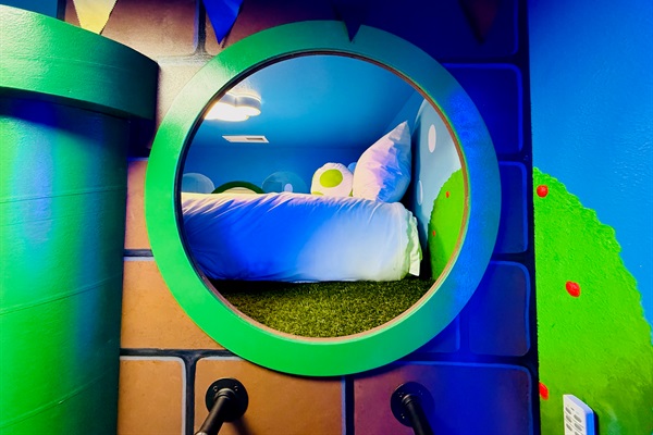 Peek in at the queen bed, accessible by ladder or stairs. 