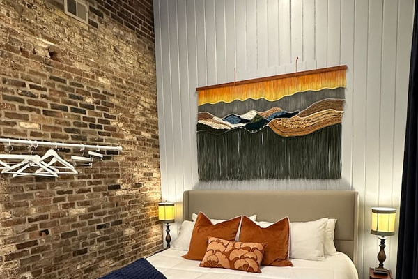 Artisan-made Textile art in the Boho Room. King bed with new Nectar mattress. 
