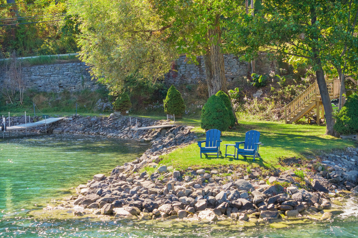 Otsego Lake's stunning summer beauty. Shared waterfront with paddleboards and kayaks