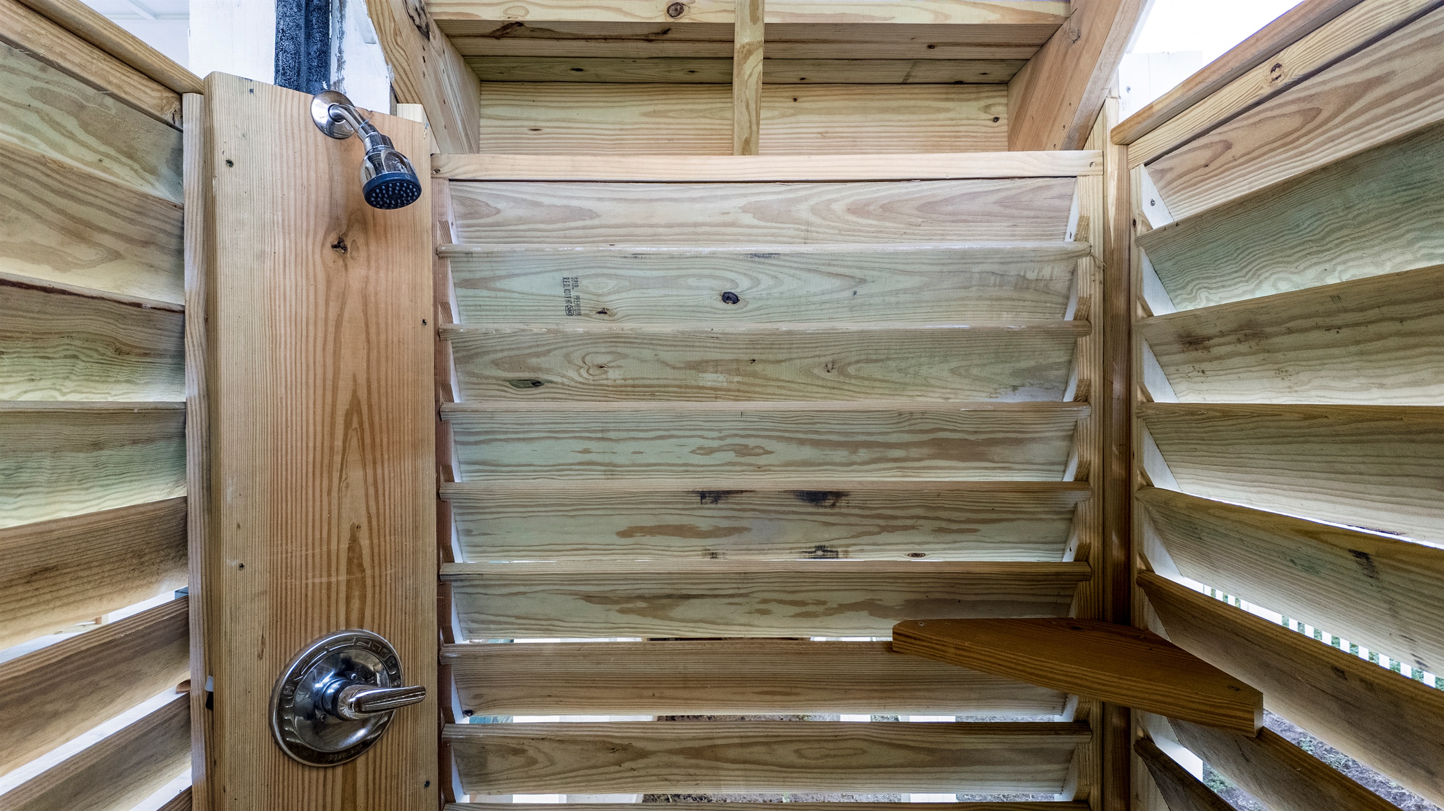 The outdoor shower is perfect to rinse off after the beach or before the pool. You'll love the hot and cold water!