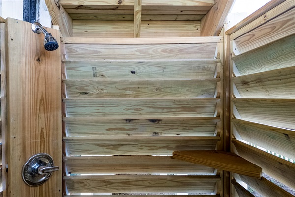 The outdoor shower is perfect to rinse off after the beach or before the pool. You'll love the hot and cold water!