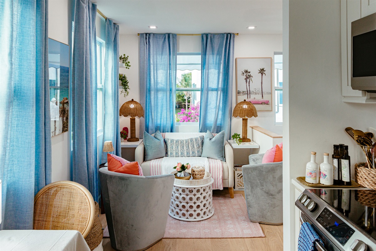 The second floor of the cottage has a cozy seating area, with the elevated setting letting in much natural light as you take in a birds-eye view of the surroundings.