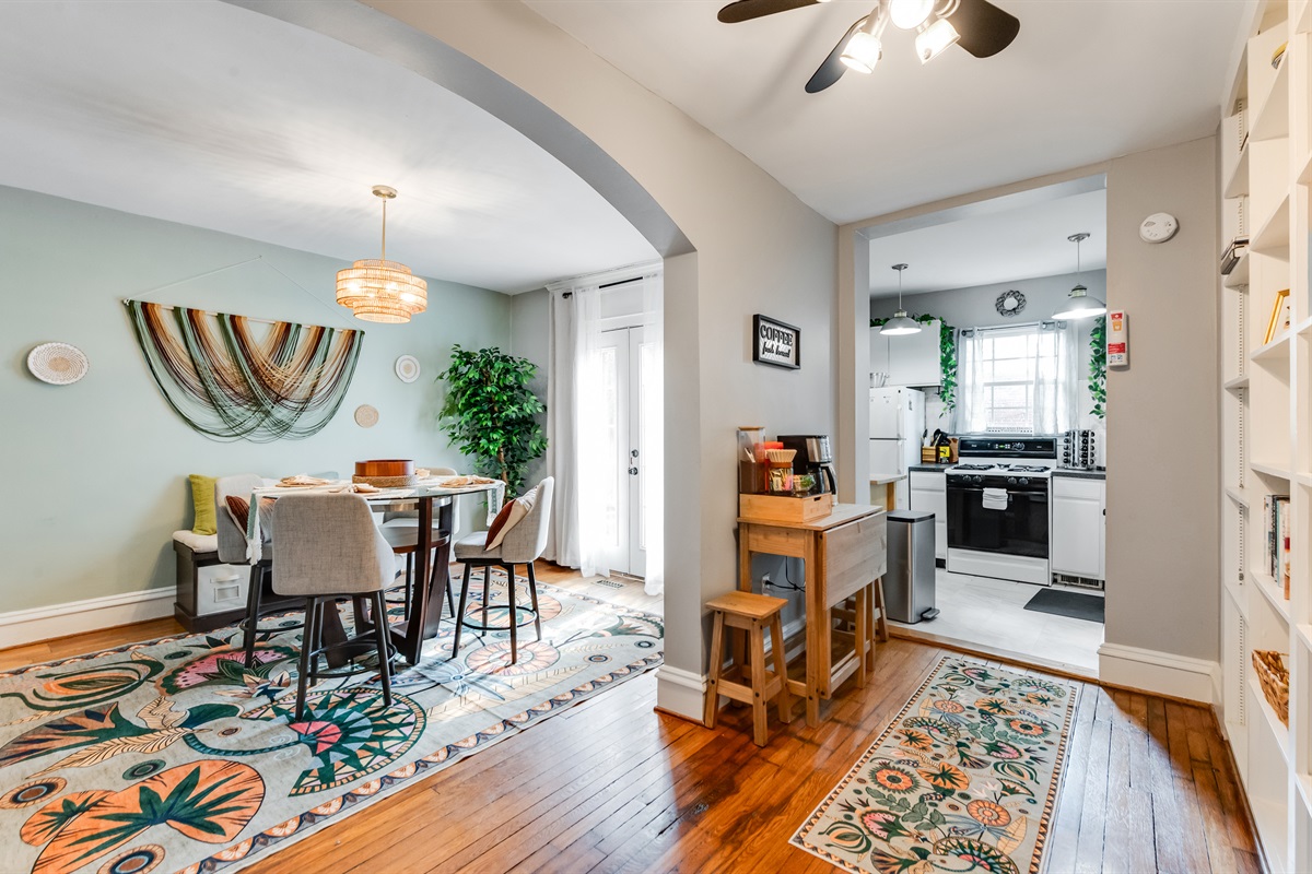 Dining Area: Bright and inviting, enjoy meals under artistic lighting with easy kitchen access!