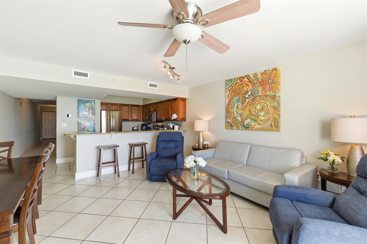 All you need from a living room, comfy recliners, couch and dining place and few steps to kitchen...