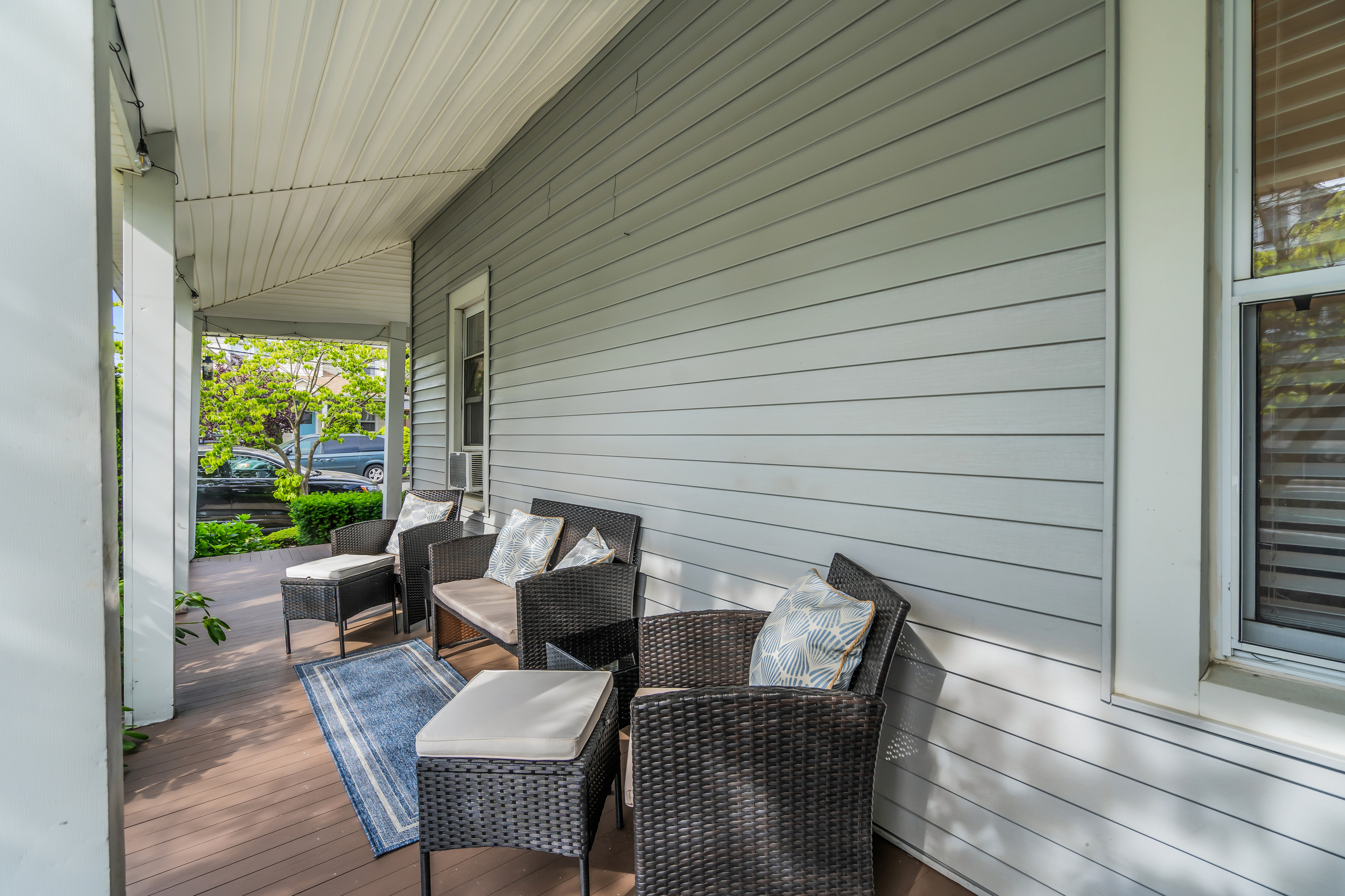Take your coffee to the covered porch at 7 a.m. Sink into the wicker chairs, watch the tree-lined street wake up, and ease into another shore morning.