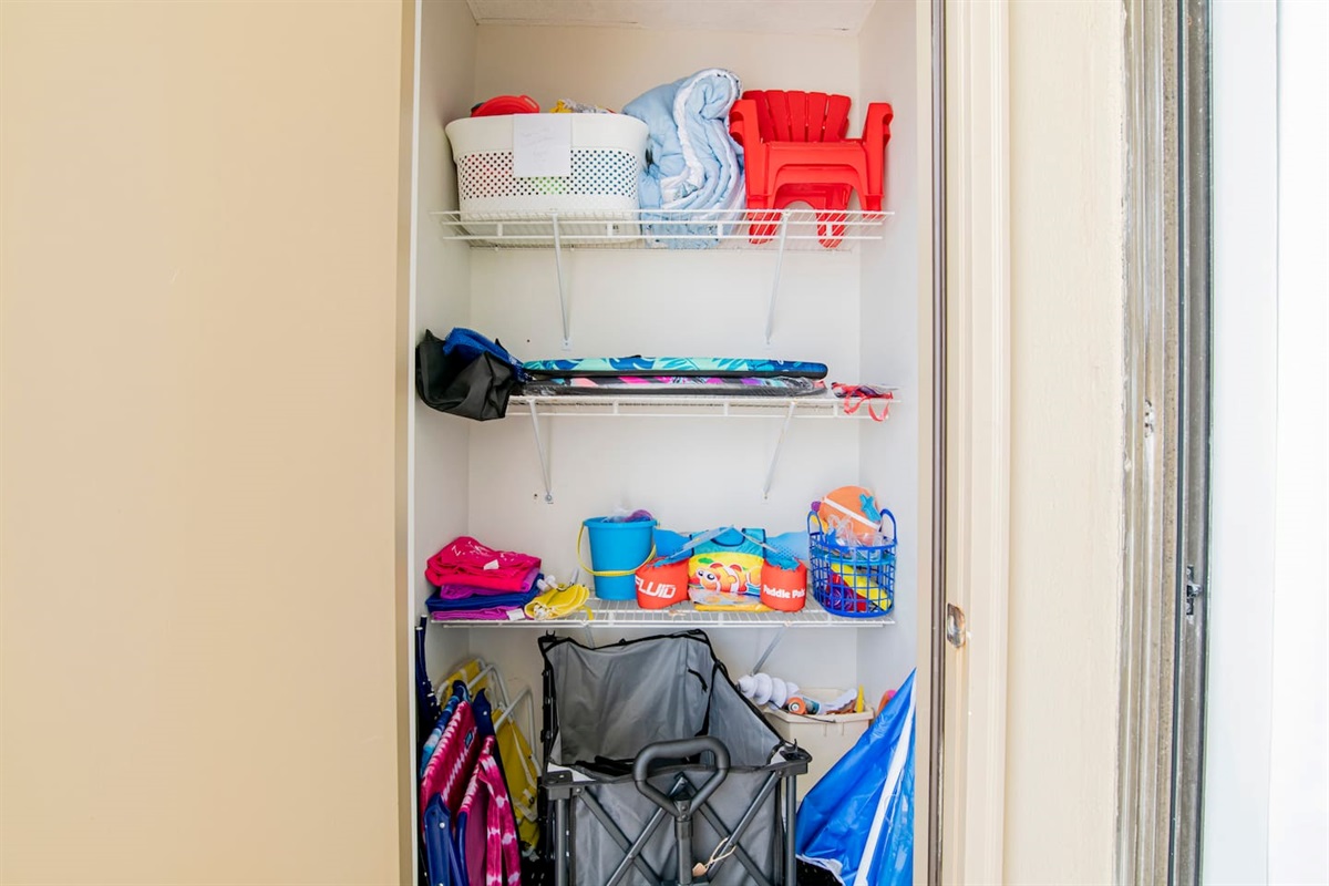Beach Closet with wagon, adult and child beach chairs, umbrellas, toys, boogie boards, and extra beach blankets. You can also rent chairs + umbrella's if you don't want to carry these back and forth. Check out Ike's Beach Service!